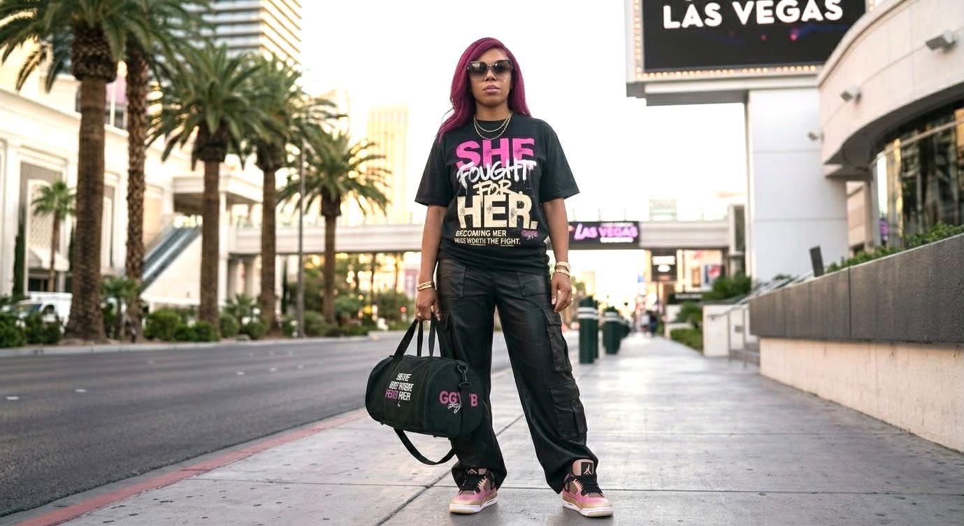 Model wearing the She Fought For Her tee with the GGYFB bag on the Las Vegas strip